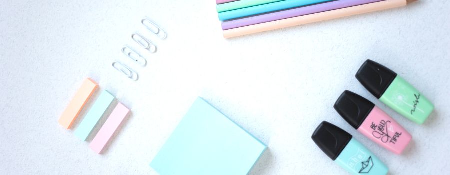 Best Journal Tips For Beginners Graphic Of Brightly Colored Highlighters And Sticky Notes For Getting Creative