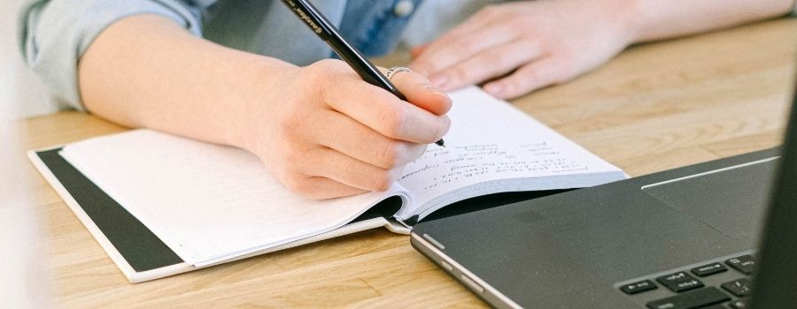 How To Journal For Beginners Example Of Woman Writing On Wooden Desk